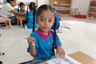 Children working with Montessori materials
